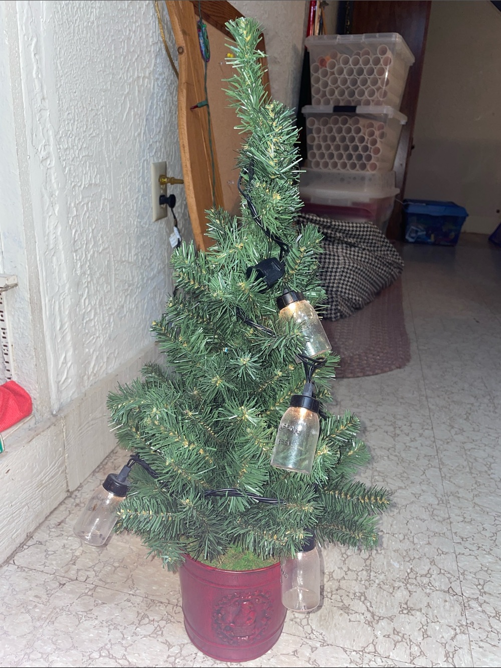 Green Mini Holiday Tree with Clear Bulb String Lights in Red Pot
